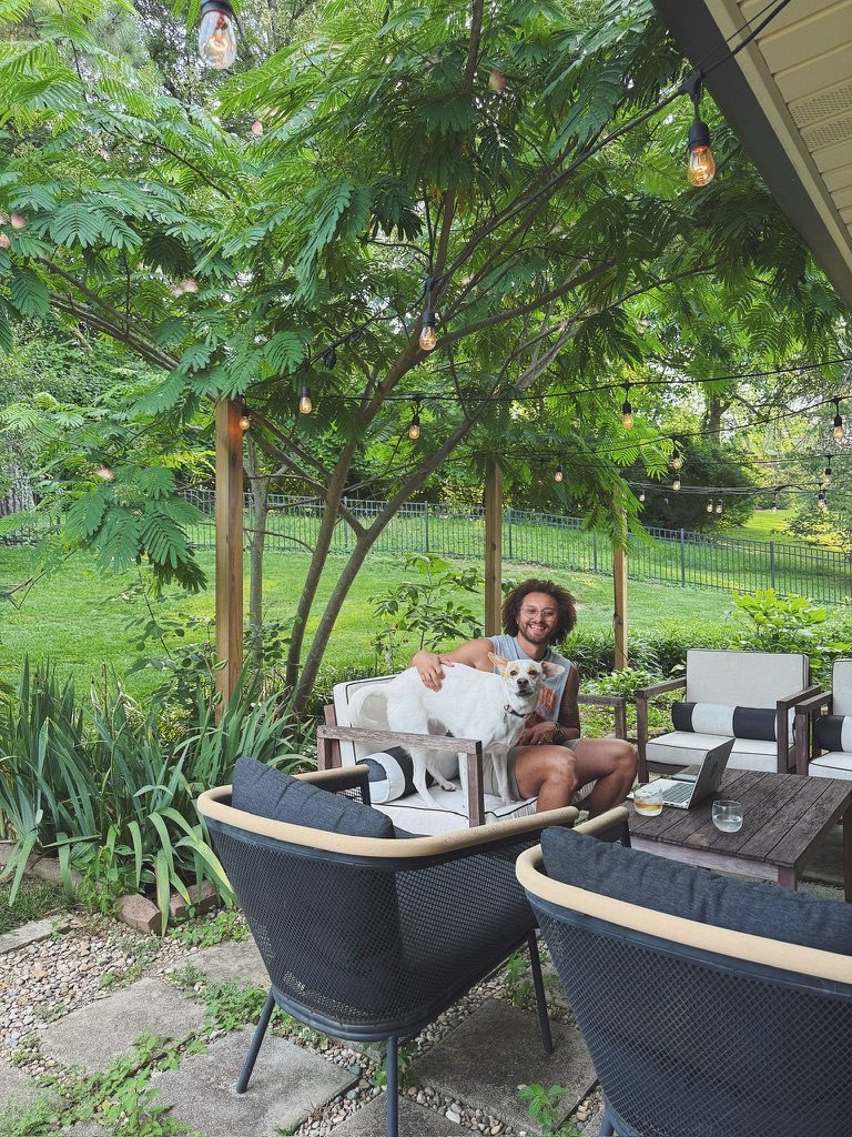 Tyler at home in the backyard with Mabel