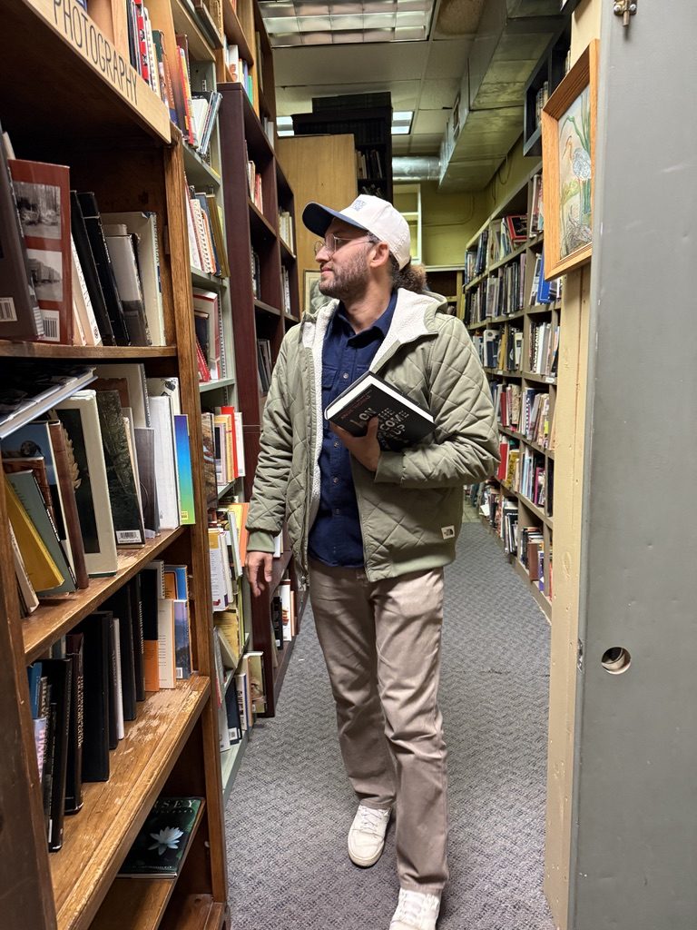 Tyler browsing a used bookstore